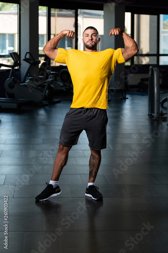 Muscular Man Posing In Yellow T-shirt