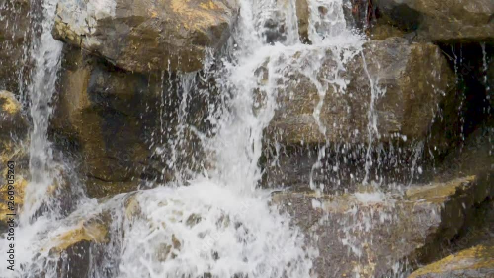Water cascading down a waterfall in slow motion Water cascading down a waterfall in slow motion