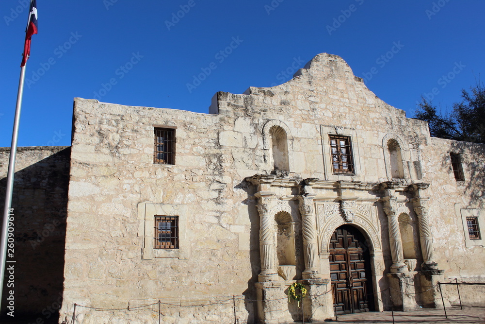 Remember the Alamo, Very historic beautiful stone construction and facade . bright blue sky .