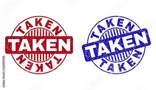 Grunge TAKEN round stamp seals isolated on a white background. Round seals with grunge texture in red and blue colors. Vector rubber imitation of TAKEN text inside circle form with stripes. photo