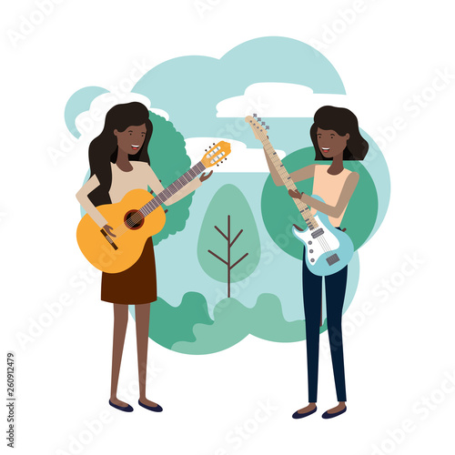 women with musical instruments in landscape