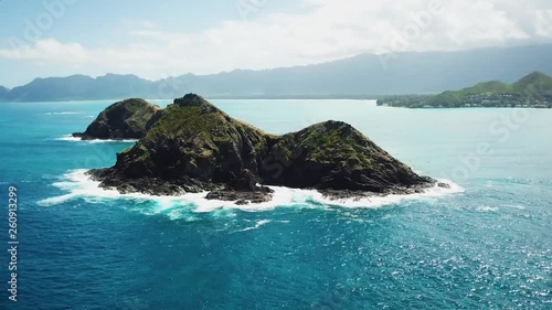 Smooth Aerial Shot of the beautiful Mokulua Islands located off the Lanikai Coast of Oahu. photo