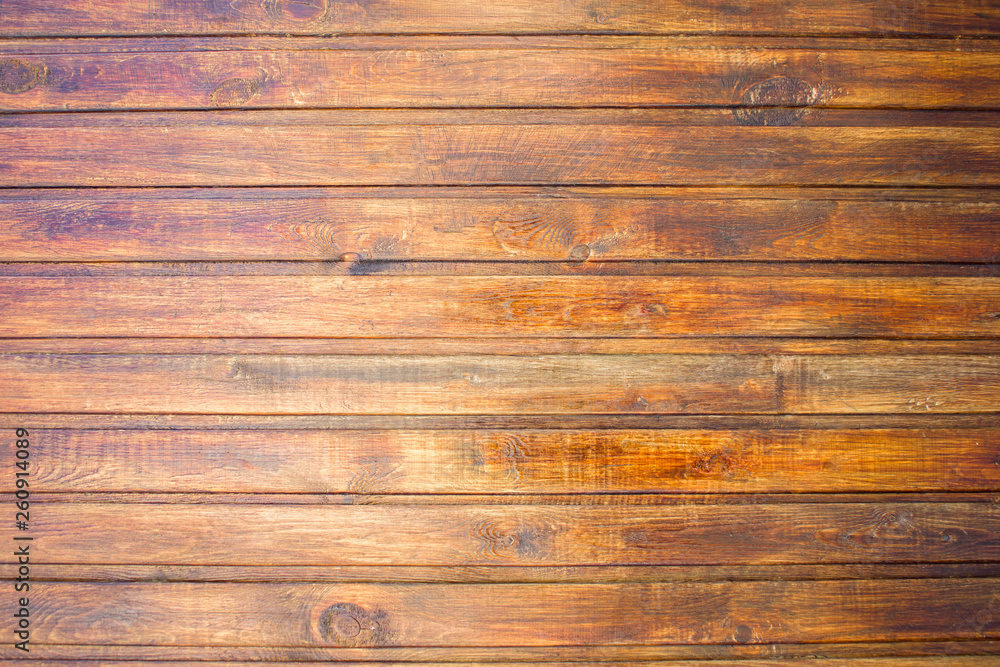 Fototapeta premium yellow brown fence wall of wooden planks. horizontal lines. rough surface texture