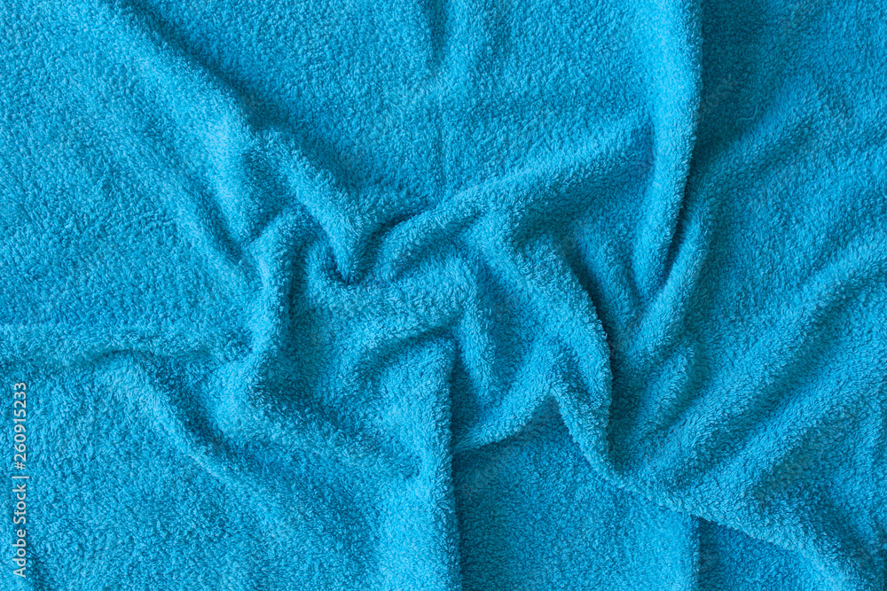 Top view of Blue Towel texture. Blue Towel Fabric Texture Background. Close-up. Blue natural cotton towel background.Space for text. Hygiene, fabric, laundry,spa and textile concept. Top view of Blue Towel texture. Blue Towel Fabric Texture Background. Close-up. Blue natural cotton towel background.Space for text. Hygiene, fabric, laundry,spa and textile concept.