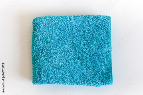 Top view of Blue Towel texture. Blue Towel Fabric Texture Background. Close-up. Blue natural cotton towel background.Space for text. Hygiene, fabric, laundry,spa and textile concept.
