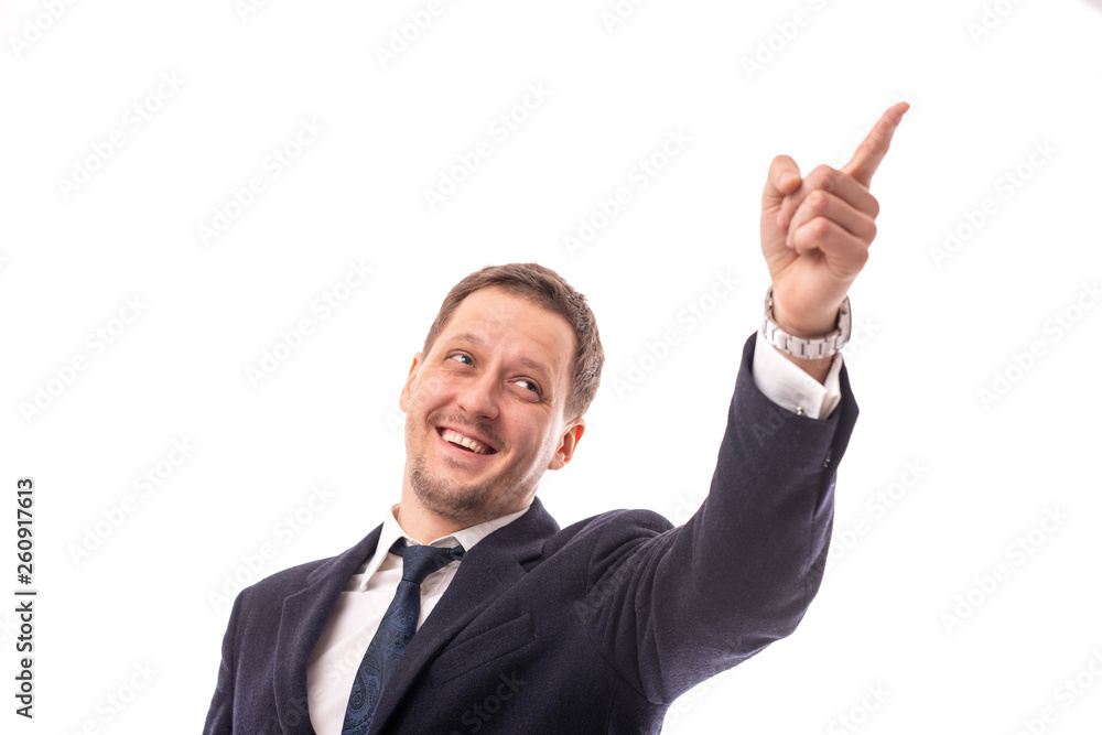 Studio shot of a young man businessman wearing dark blue jacket proves something by showing his index finger. Studio shot of a young man businessman wearing dark blue jacket proves something by showing his index finger.