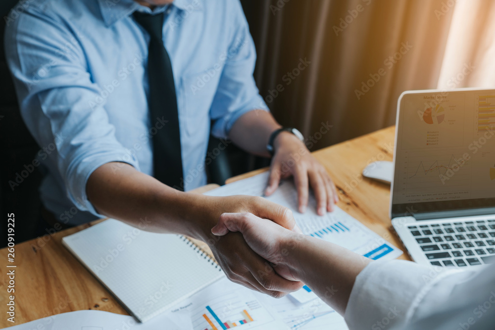Business people shaking hands, finishing up meeting.reliable handshake of business partners Business people shaking hands, finishing up meeting.reliable handshake of business partners
