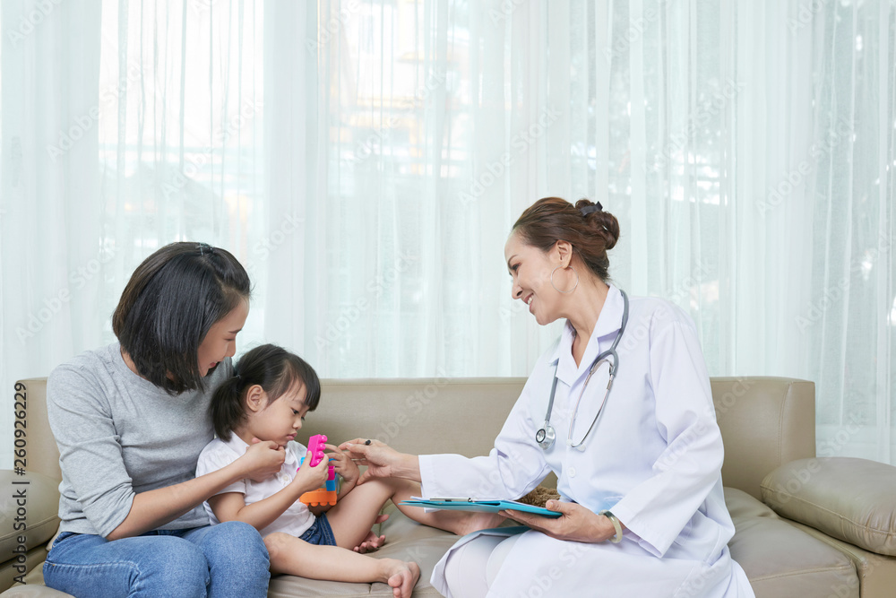 Fototapeta premium Pediatrician with little patient at hospital