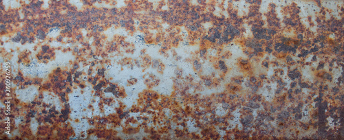 Heavily worn red peeled rusty wall. rust wall texture,abstract background,concrete pattern,ideas graphic design for web or banner