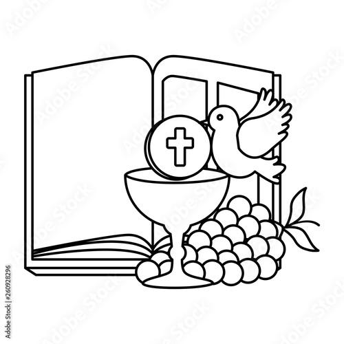 holy bible with chalice and grapes
