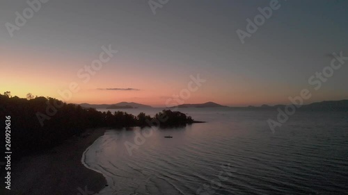 Flyover ocean beach Philippines by sunset