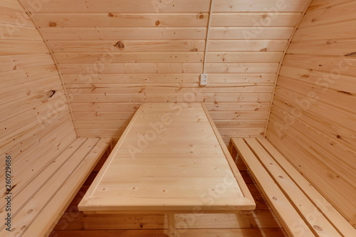 interior of wooden bath in the form of a barrel. Rural mobile bath