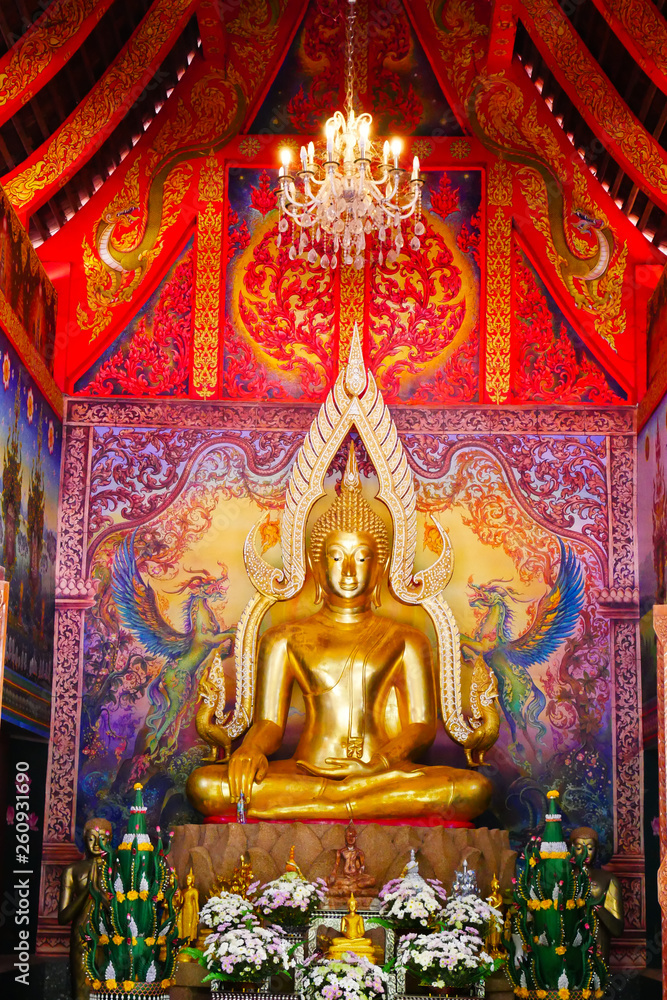 Buddha statue in Phutthanimit Bureau of Monks, the Thai  traditional and public temple in contry side of Nakhon Phanom Province and Tha Uthen District in Thailand