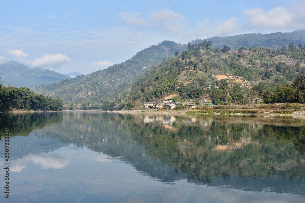 The view on the oxbow - Subansir river and hills with bamboo houses and the rainforest, Daparijo, Arunachal Pradesh, India