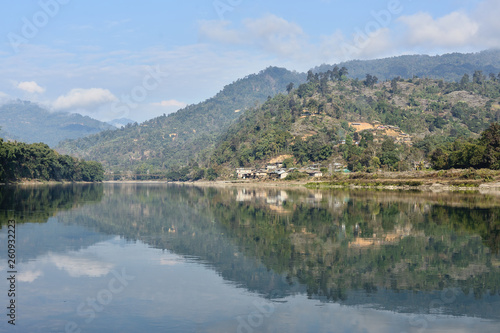 The view on the oxbow - Subansir river and hills with bamboo houses and the rainforest, Daparijo, Arunachal Pradesh, India
