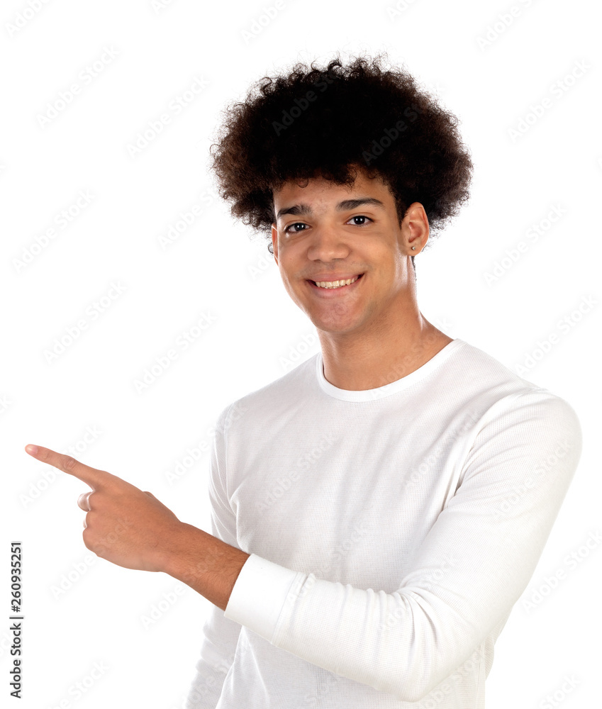 Afro teenager with with afro hair pointing something with his finger Afro teenager with with afro hair pointing something with his finger