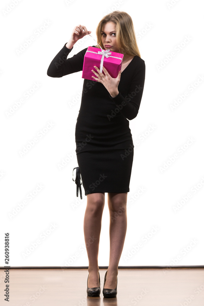 Fototapeta premium Girl opening pink gift box