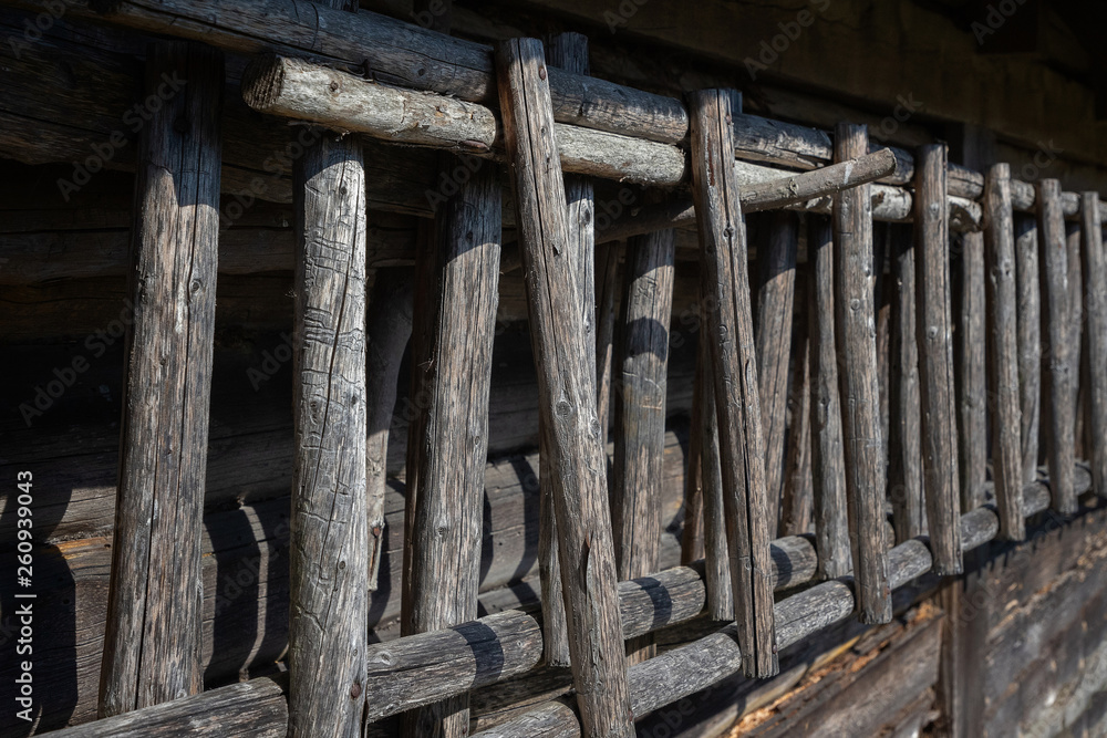 wooden ladders stand by the barn