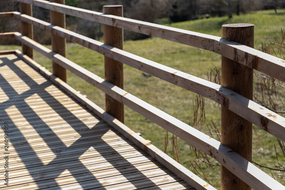 Sunlit shadows on wooden bridge Sunlit shadows on wooden bridge