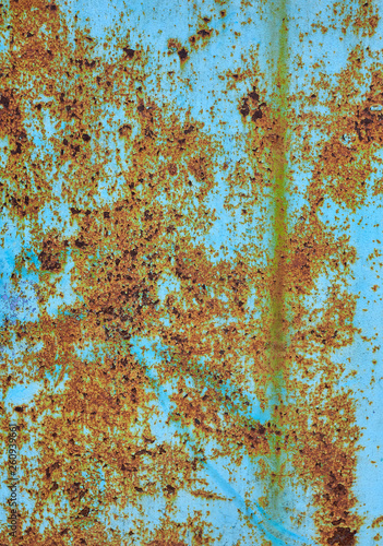 old rusty metal surface with cracked faded paint