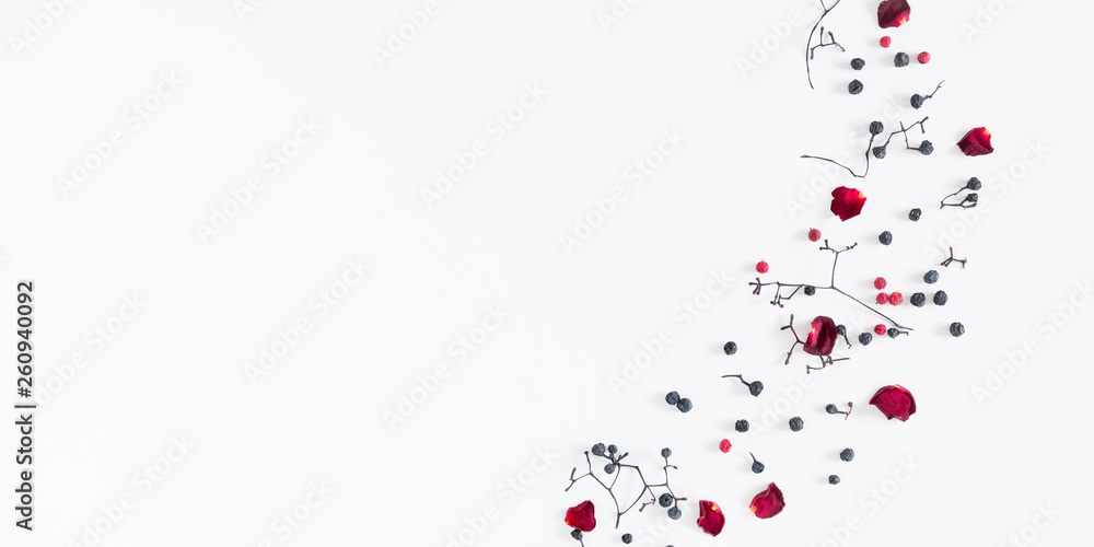 Autumn creative, modern composition. Frame made of berries, dry roses, petals on white background. Autumn, fall elegant concept. Flat lay, top view, copy space 