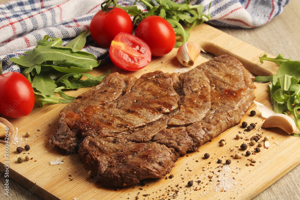 A beef steak well done with vegetables A beef steak well done with vegetables