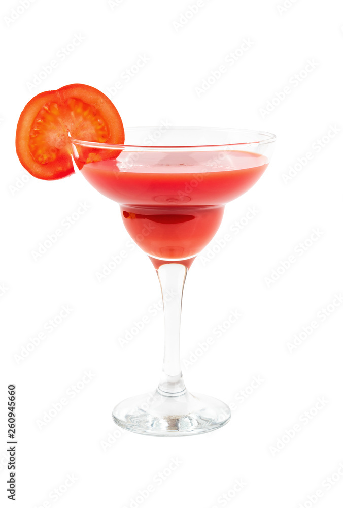 Tomato juice in a cocktail glass with a slice of tomato and parsley on a white isolated background Tomato juice in a cocktail glass with a slice of tomato and parsley on a white isolated background