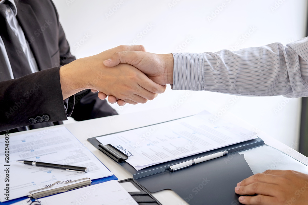 Successful job interview, Boss employer in suit and new employee shaking hands after negotiation and interview, career and placement concept Successful job interview, Boss employer in suit and new employee shaking hands after negotiation and interview, career and placement concept