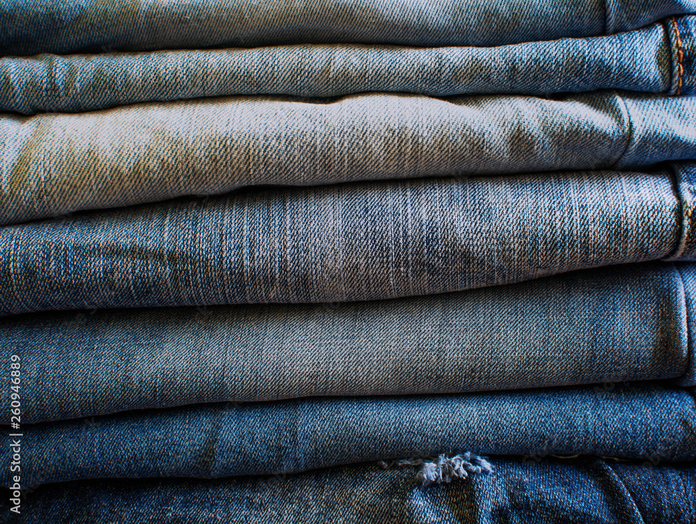 jeans stacked in a stack occupying the space of the entire frame