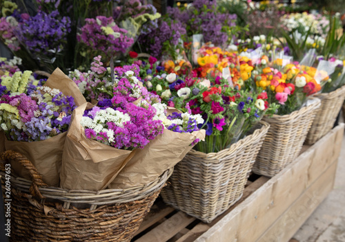 Everyday flowers counter with variety of fresh cut flowers such as statice salem or limonium sinuatum, anemone coronaria, persian buttercups for your interior decor at the greek garden shop.