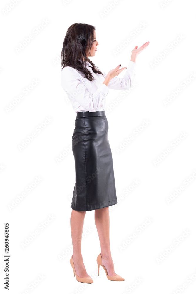 Young teacher or business woman presenting or showing blank copy space. Full body isolated on white background. Young teacher or business woman presenting or showing blank copy space. Full body isolated on white background.