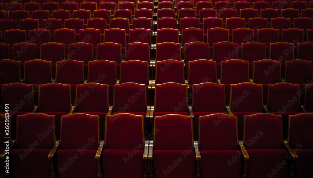 Empty comfortable red seats in a hall 