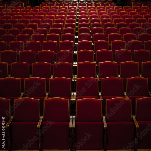 Empty comfortable red seats in a hall 
