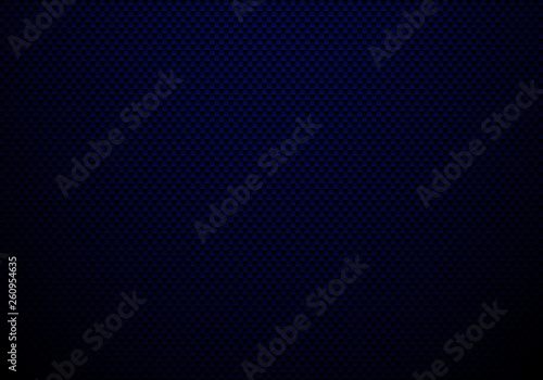 Dark blue carbon fiber background and texture with lighting. Material wallpaper for car tuning or service.