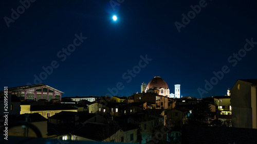 Moonlight sky over Firenze's skyline with dome landmark on a bright night in Tuscany, Italy