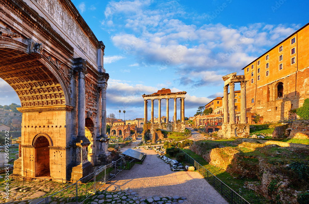 Roman Forum in Rome, Italy. Antique structures with columns. Wrecks of ancient italian roman town. Sunrise above famous architectural landmark.