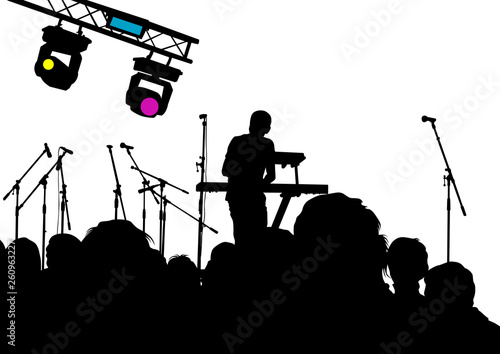 DJ with microphones on stage in front of public and light equipment