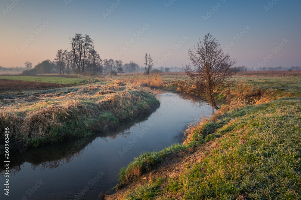 Valley of the Jeziorka River on a foggy morning near Piaseczno, Masovia, Poland Valley of the Jeziorka River on a foggy morning near Piaseczno, Masovia, Poland