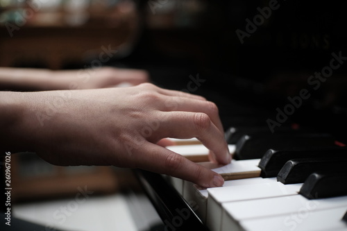Beautiful woman playing piano, learn to play piano.