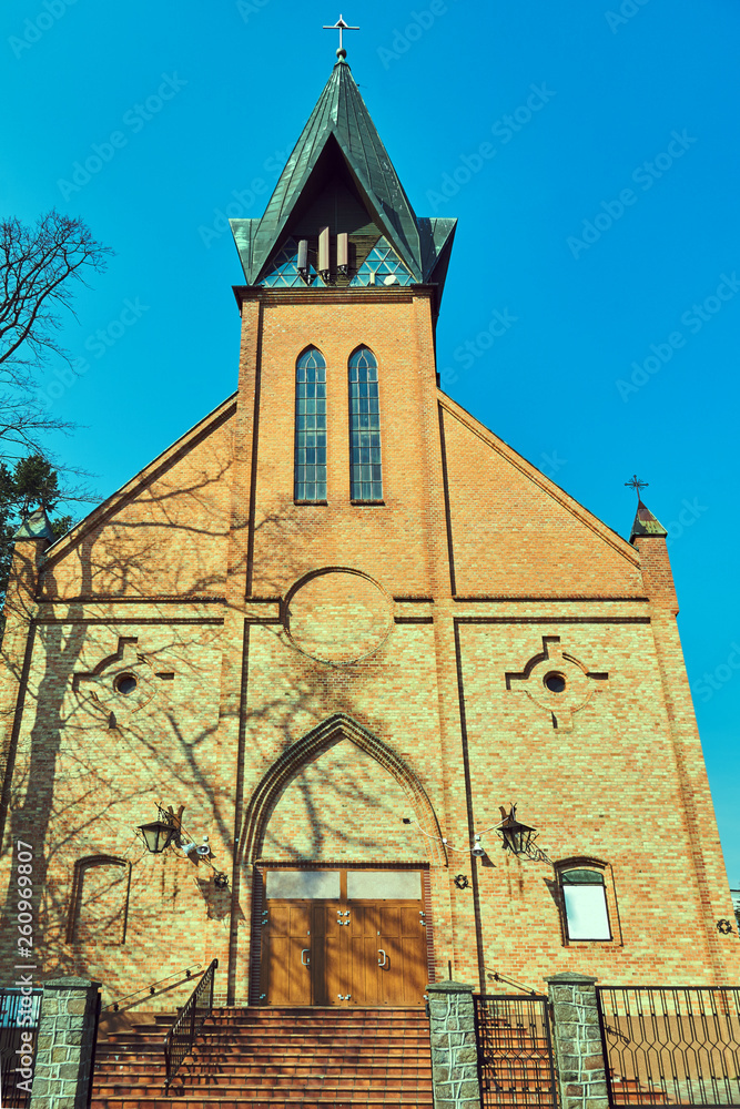 Fototapeta premium facade of a neo-gothic church in the city of Ustronie Morskie.