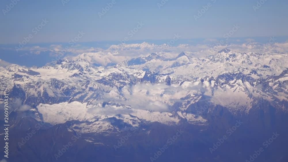 Alps mountains in spring, Italy. Aerial view from air plane Alps mountains in spring, Italy. Aerial view from air plane