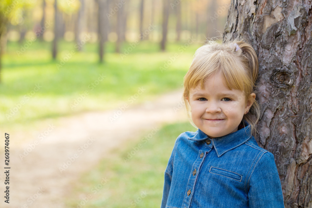 portrait of happy little girl with smile on face on sunny day portrait of happy little girl with smile on face on sunny day