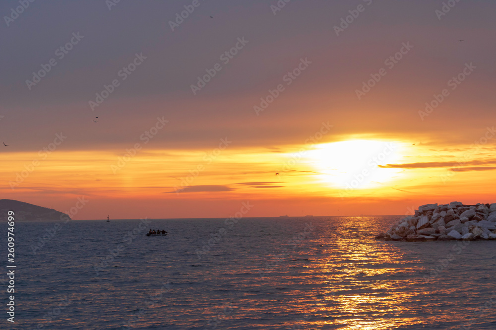 Obraz premium People in private boat sailing at sunset in Istanbul