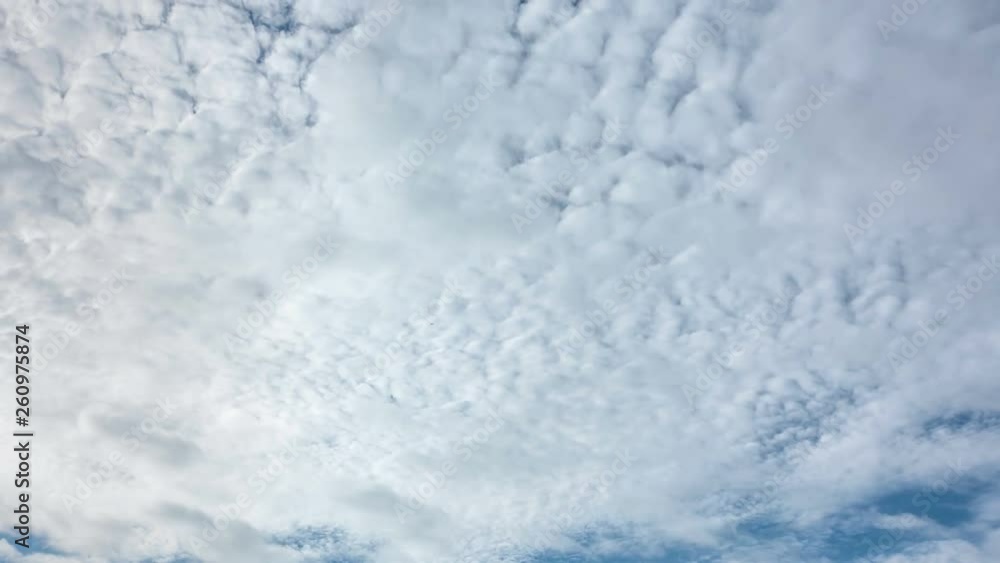 White clouds moving and rolling on blue sky background. 4k time lapse footage. White clouds moving and rolling on blue sky background. 4k time lapse footage.