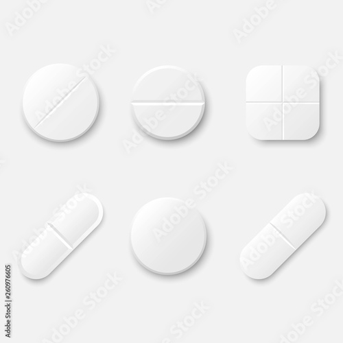 Set of white realistic medical pills. Round and oval tablets, painkillers, antibiotics, vitamins and aspirin. Medicine and drugs. Template design for medical and healthcare concept.