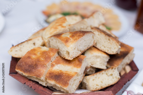 freshly baked Georgian pita bread on a plate on the table.