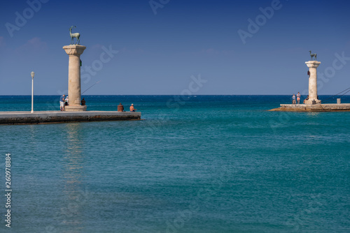 Rhodos, Greece - August 2016: Hirschkuh statue in the place of the Colossus of Rhodes at the entrance from inner embankment in the Mandraki old harbour of the City of Rhodes, in the Greek Dodecanese.