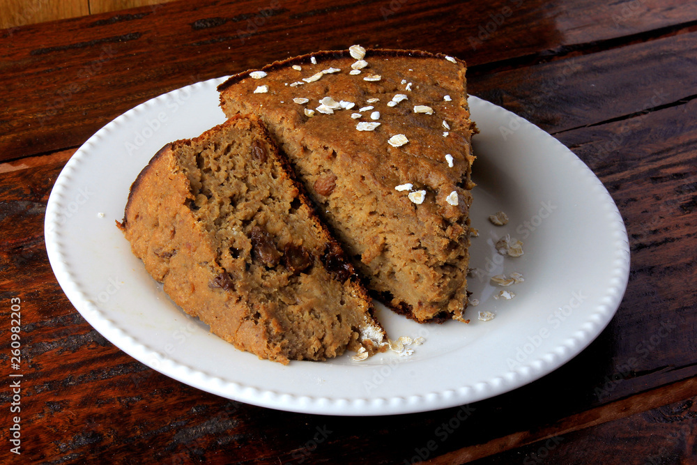 Healthy homemade banana cake made with oatmeal on rustic wooden table. sugar-free, milk-free, gluten-free