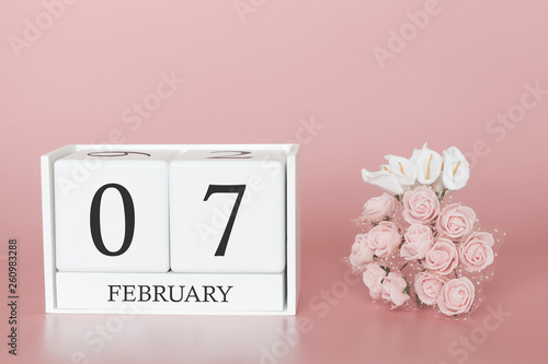 February 07th. Day 7 of month. Calendar cube on modern pink background, concept of bussines and an importent event. photo