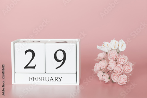 February 29th. Day 29 of month. Calendar cube on modern pink background, concept of bussines and an importent event. photo